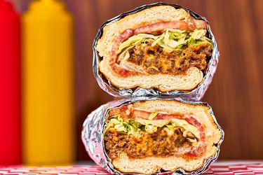 Chopped cheese sandwich stacked on top of one another.