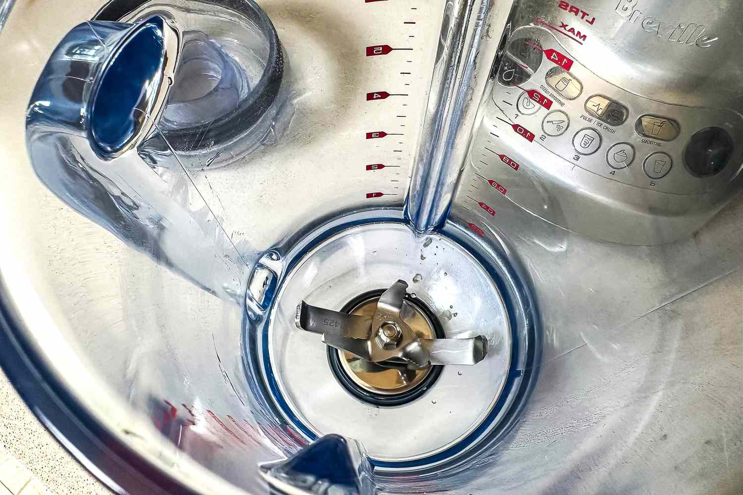 An overhead view into the jar of the Breville Fresh and Furious Blender, with a closeup on the blades