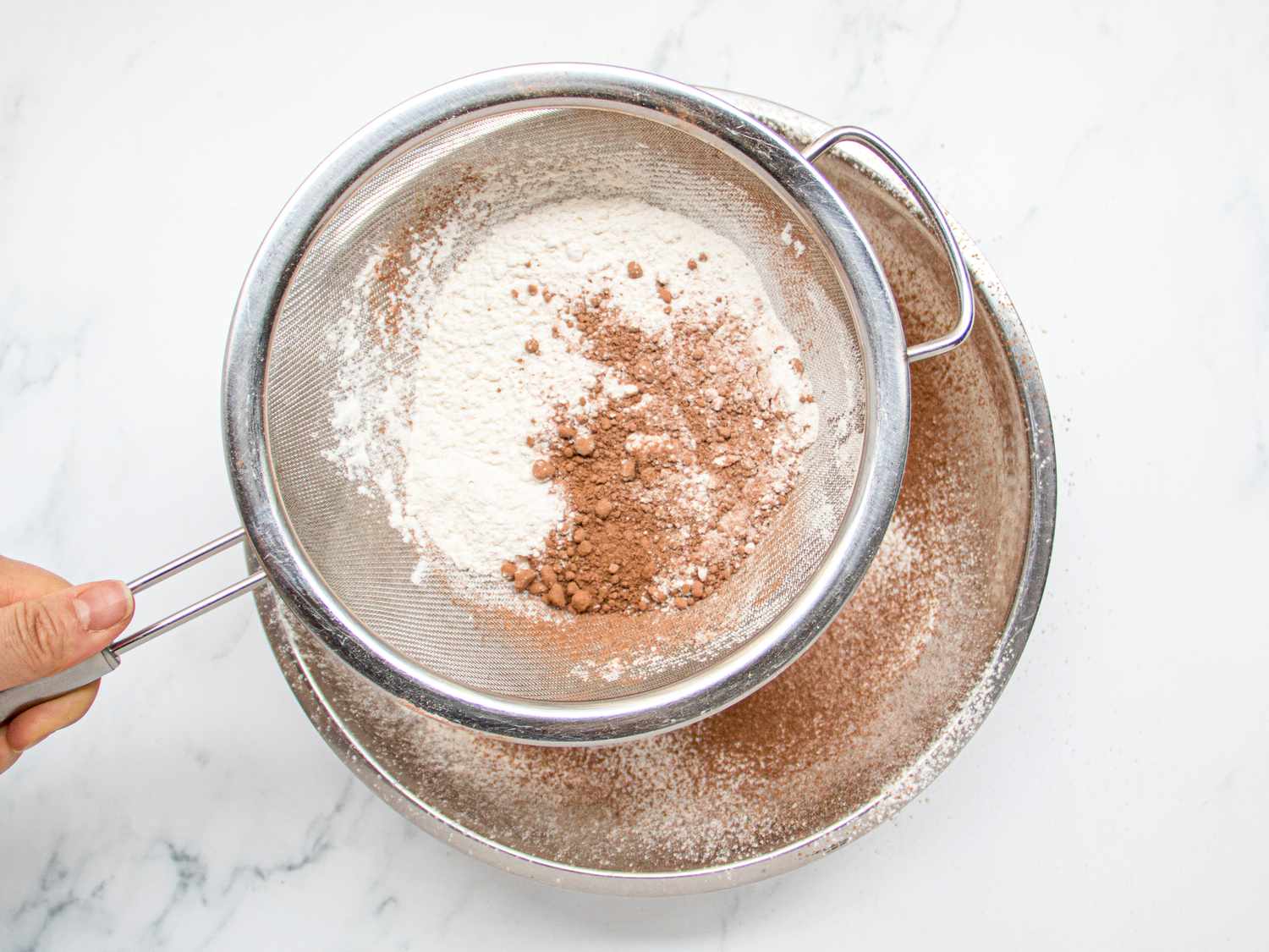 Overhead view of shifting flour