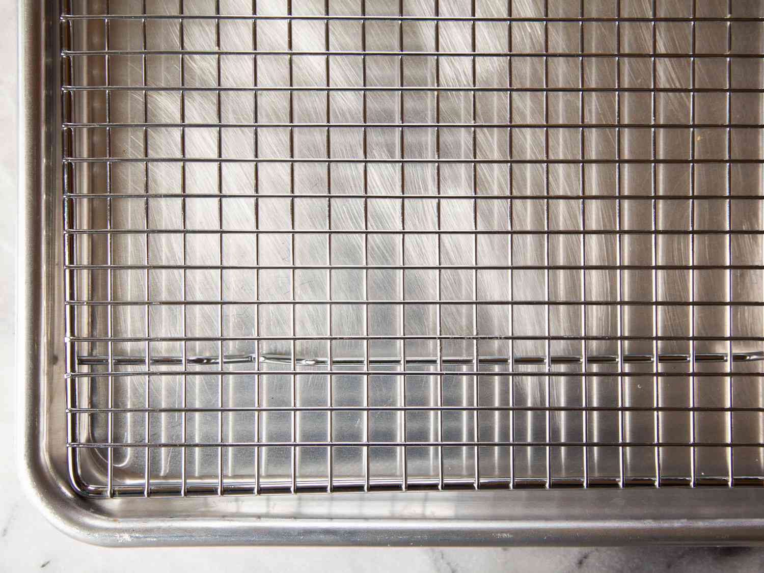 A closeup Mrs. Anderson's Baking Half Sheet Baking and Cooling Rack in a baking sheet