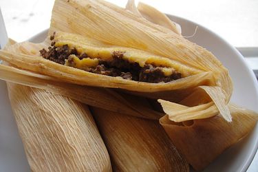 Four Mississippi Delta hot tamales on a plate. 
