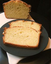 Slices of EVO and yogurt cake, served on a black plate.