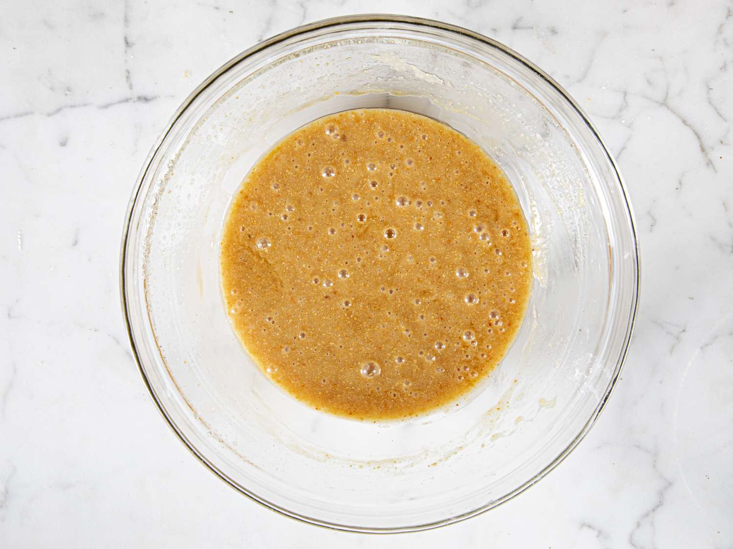 Financier batter in a glass bowl