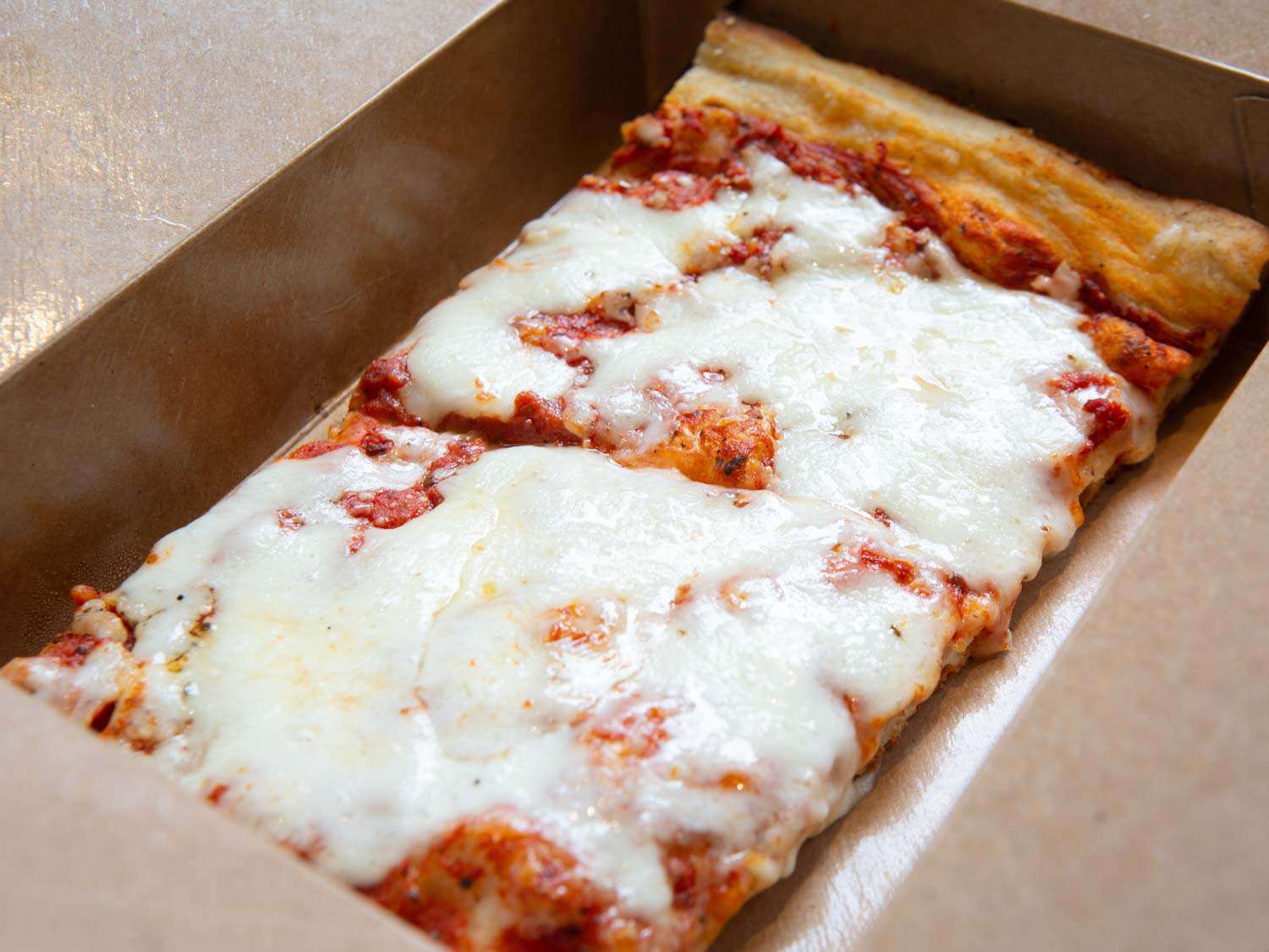 Two square slices from My Pie Pizzeria Romana