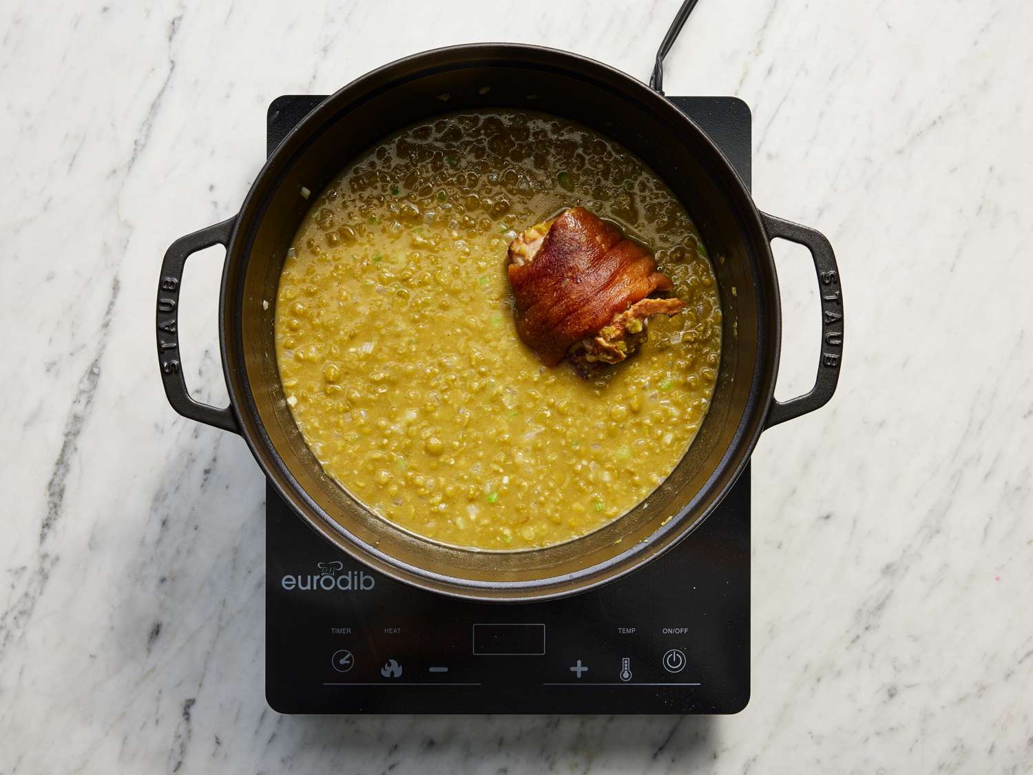 Stock and ham added to dutch oven