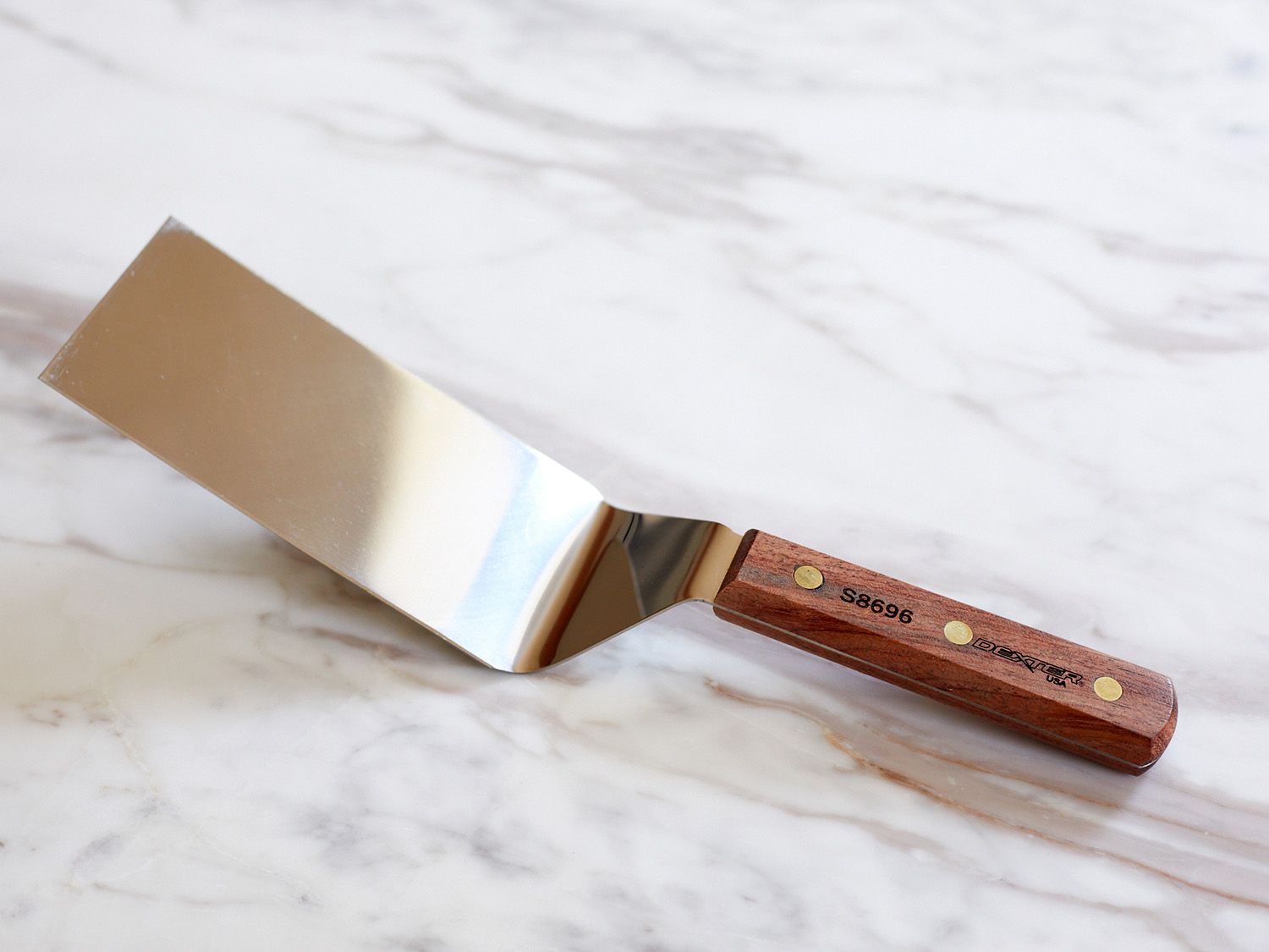 Dexter Russell offset metal turner on a marble countertop 