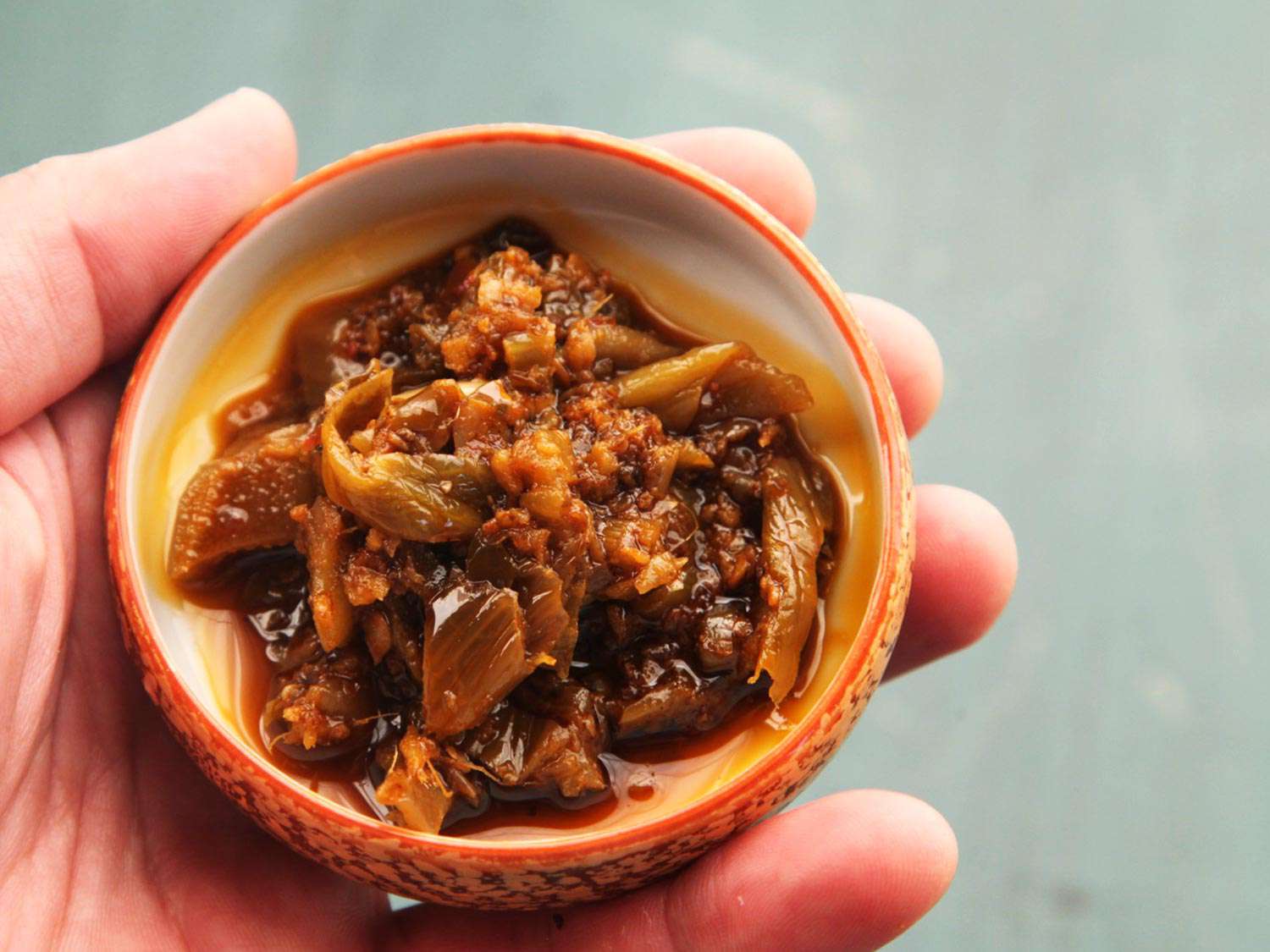 A small ramekin of ya cai (Sichuan preserved mustard).