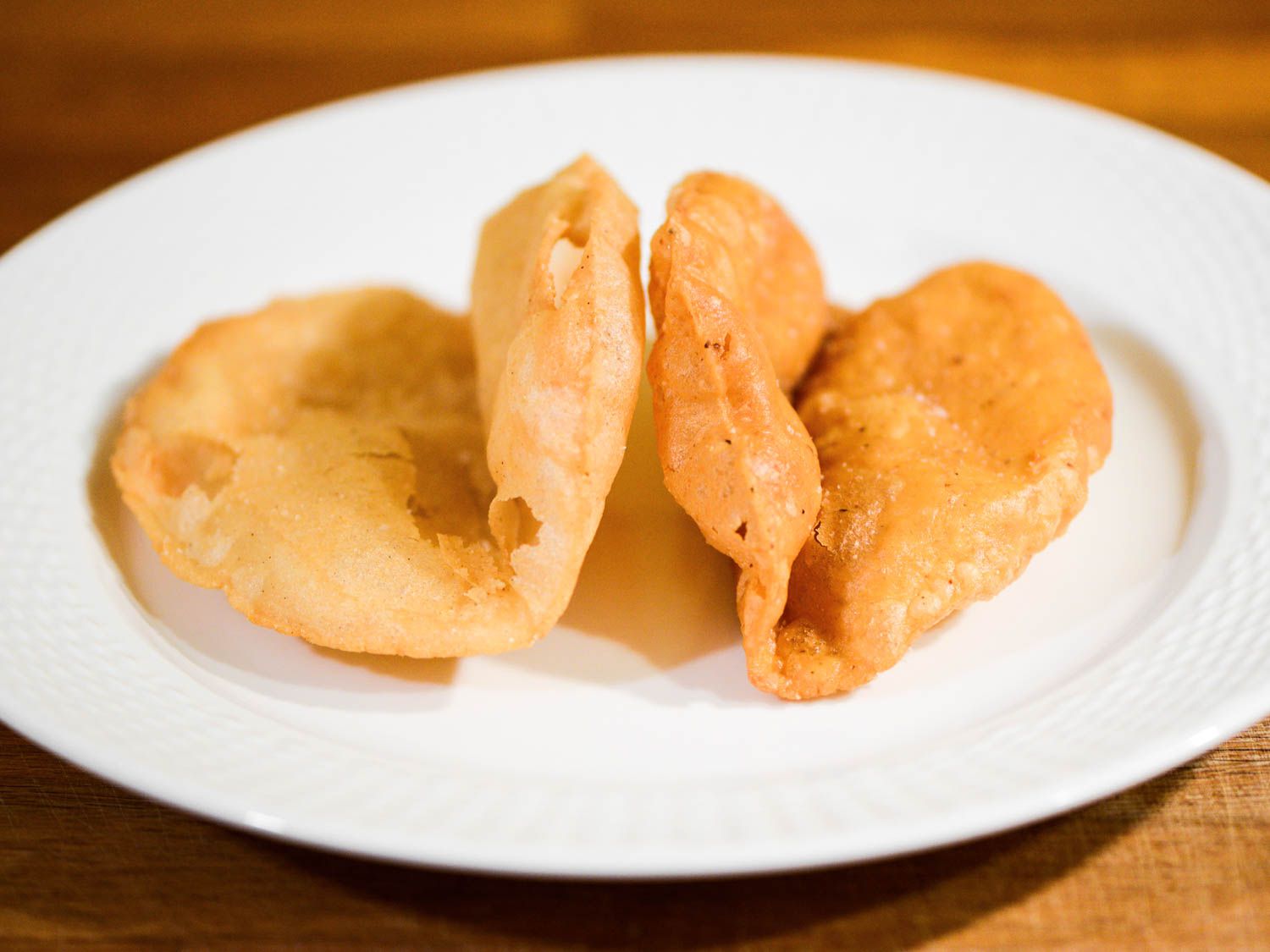 Two deep-fried masa tortillas for San Antonio-style puffy tacos