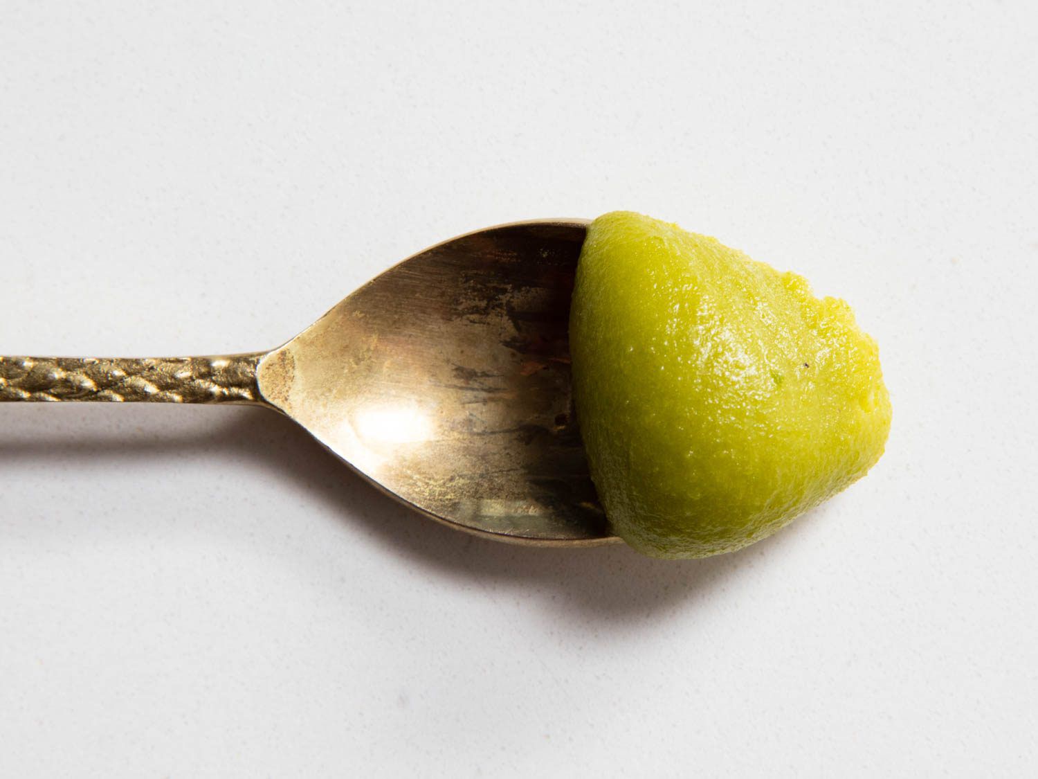 A spoonful of fresh pistachio paste.
