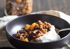 A bowl of light and crisp homemade granola served with yogurt. 