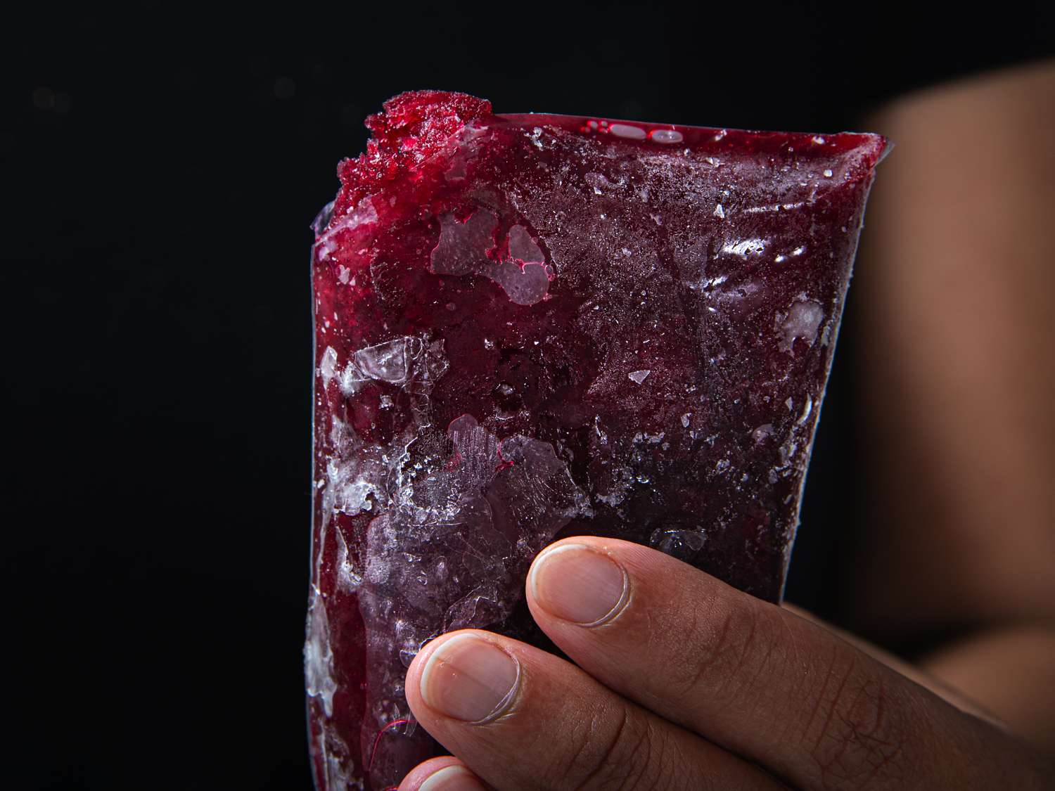 Close up of a frozen boli bag with the corner cut off