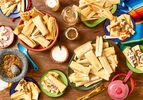 Overhead view of tamales on a table spread