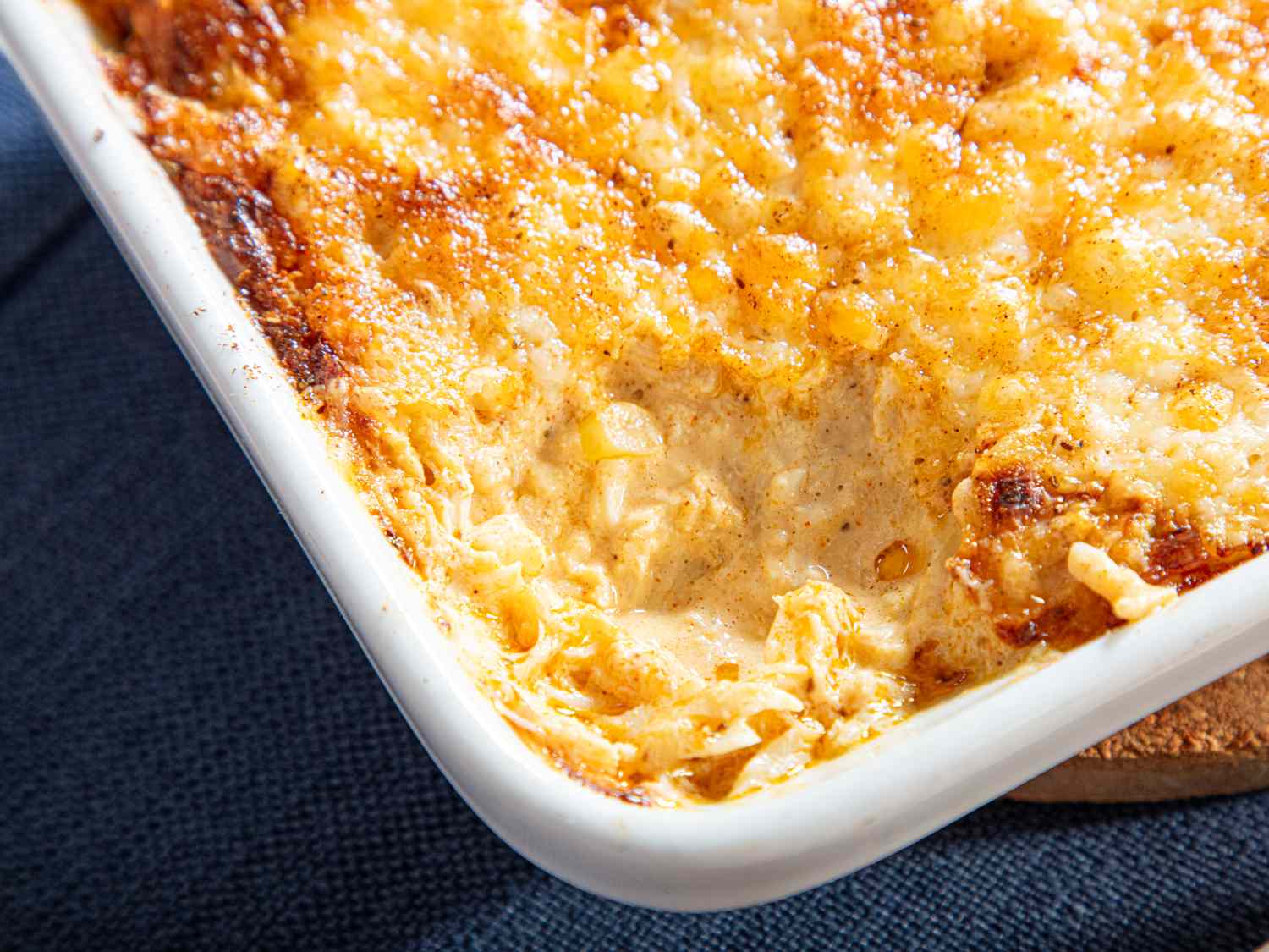 Baked spicy crab dip served in a white dish