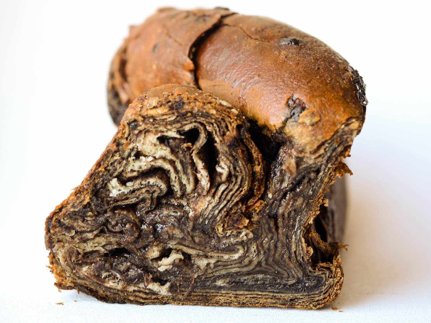 Photo of the cross section of a chocolate babka.