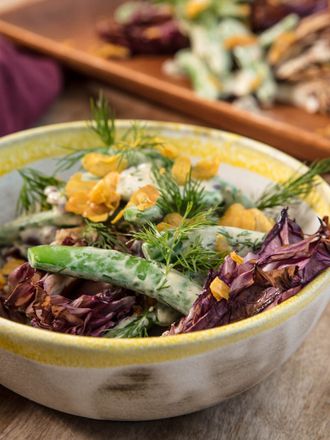 Sugar snap peas with garlic yogurt dressing and charred radicchio