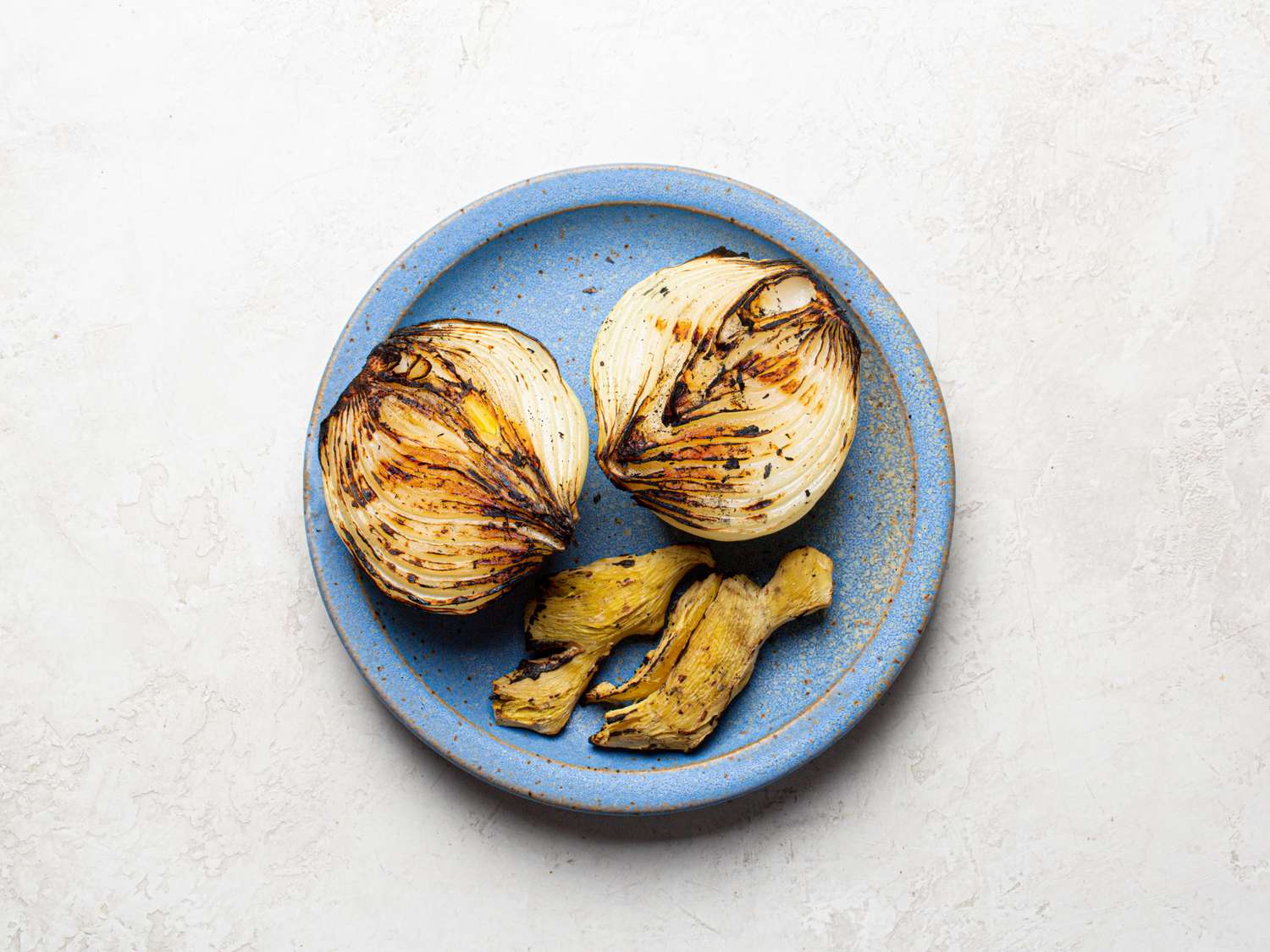 Overhead view of charred onion and ginger