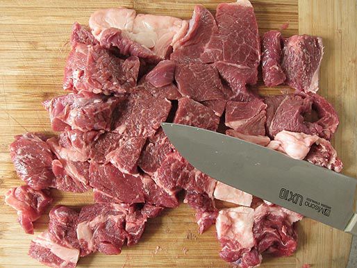 Raw beef chuck cut into chunks