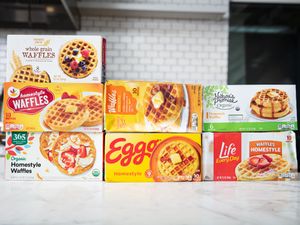 Six boxes of waffle brands arranged on a countertop