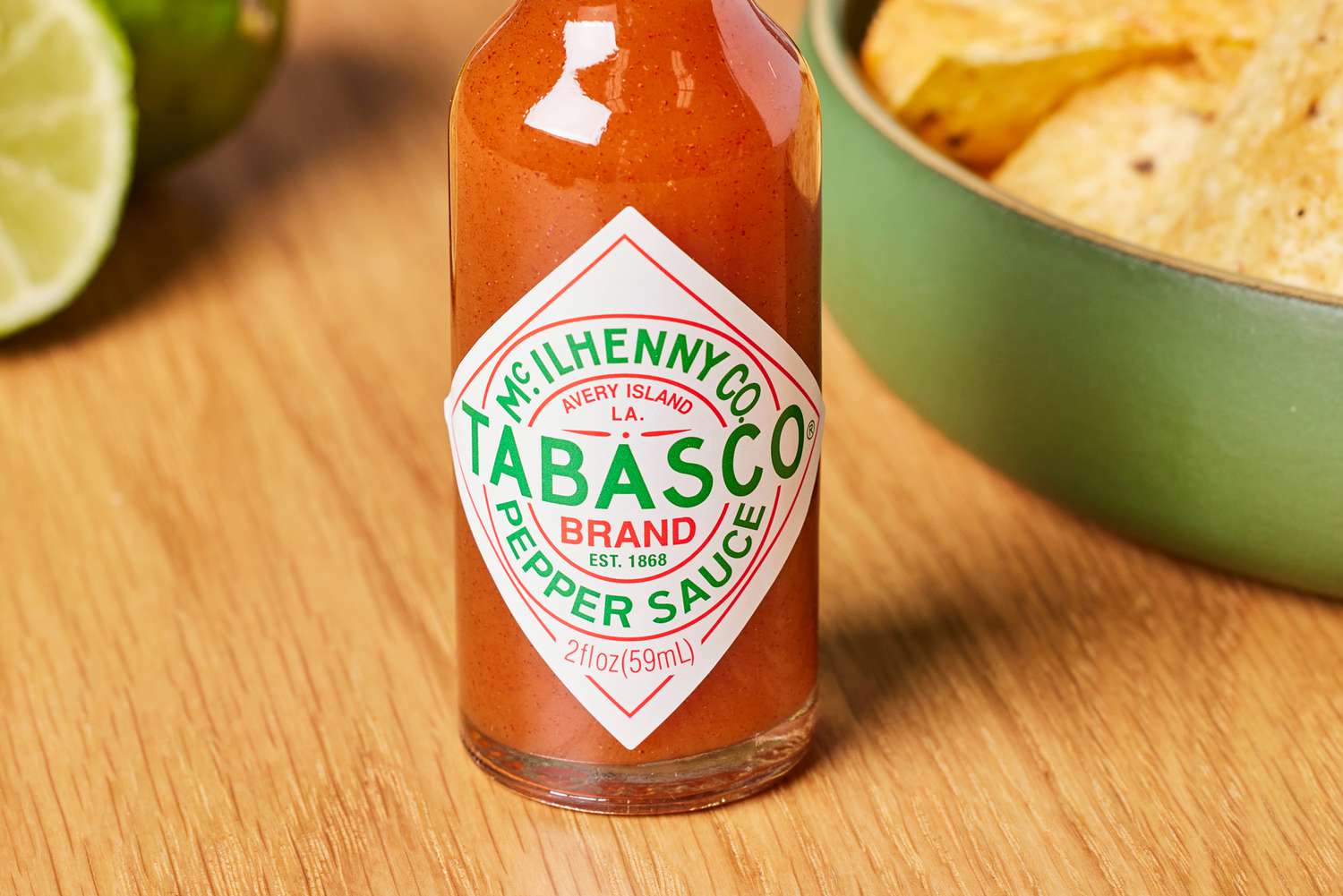 Tabasco Original Red Sauce next to bowl of chips