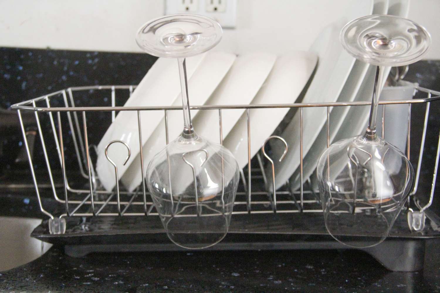 The Rubbermaid dish rack full of dishes.