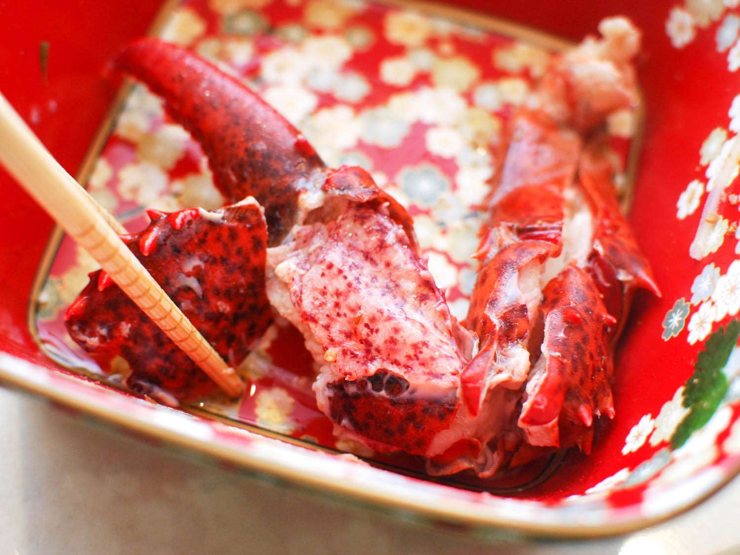 Cooked lobster meat during a Chinese hot pot feast.