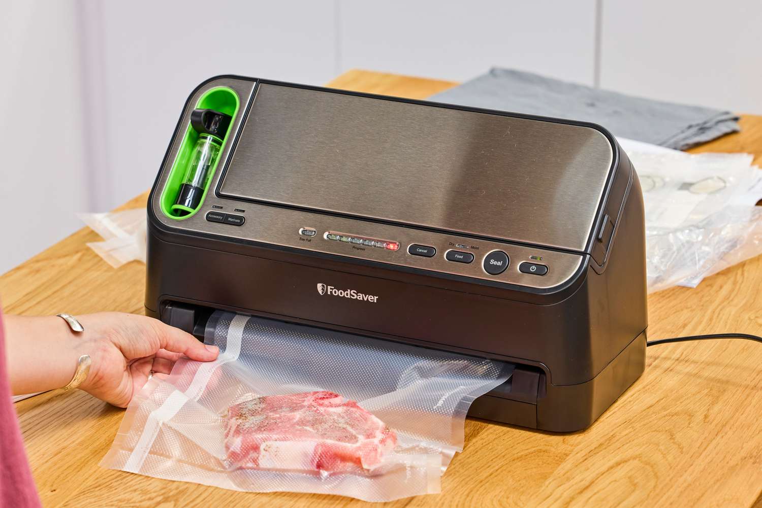 Meat is vacuumed using the FoodSaver V4400 2-in-1 Vacuum Sealer Machine