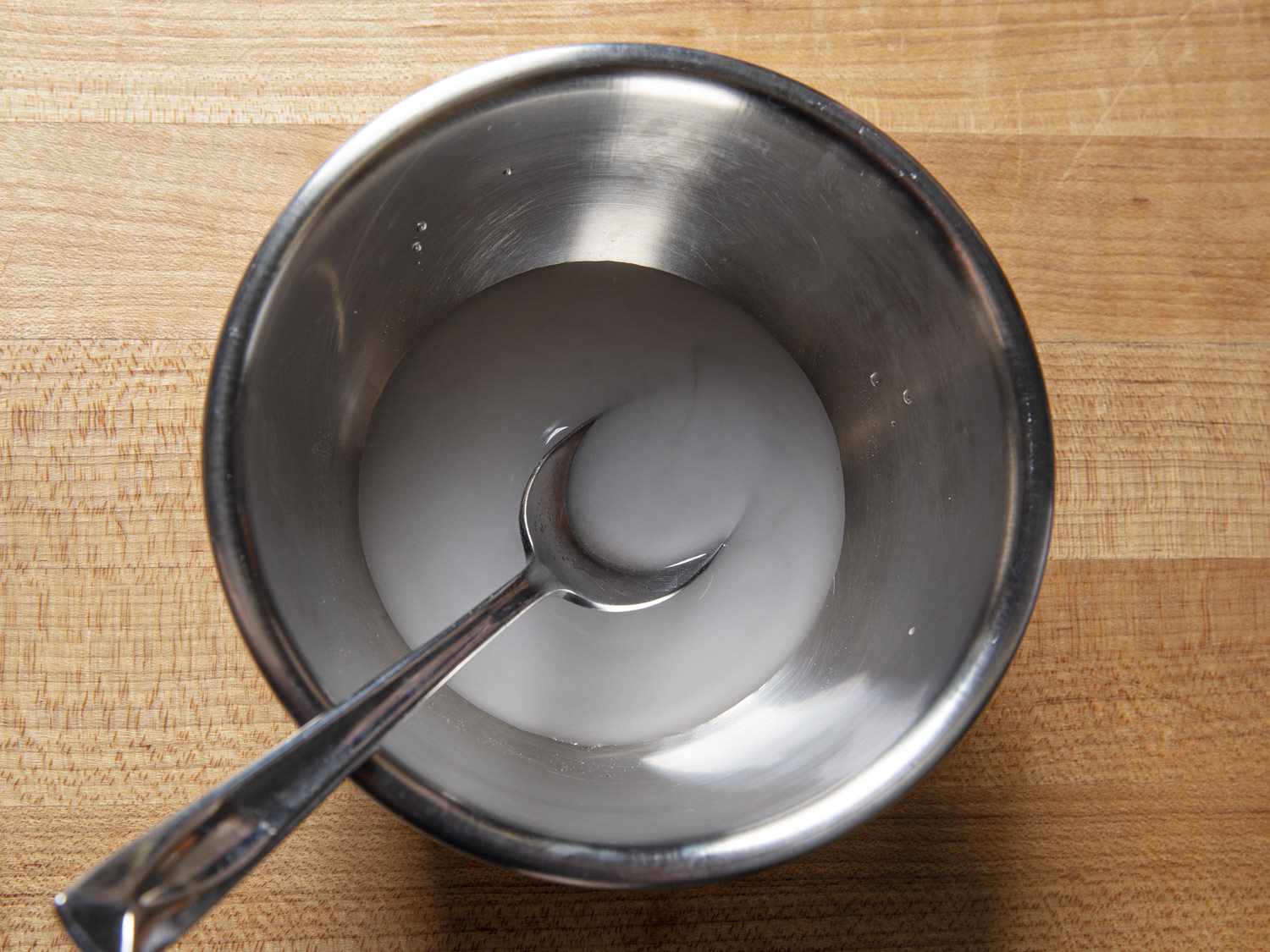 Metal bowl with potato starch slurry.
