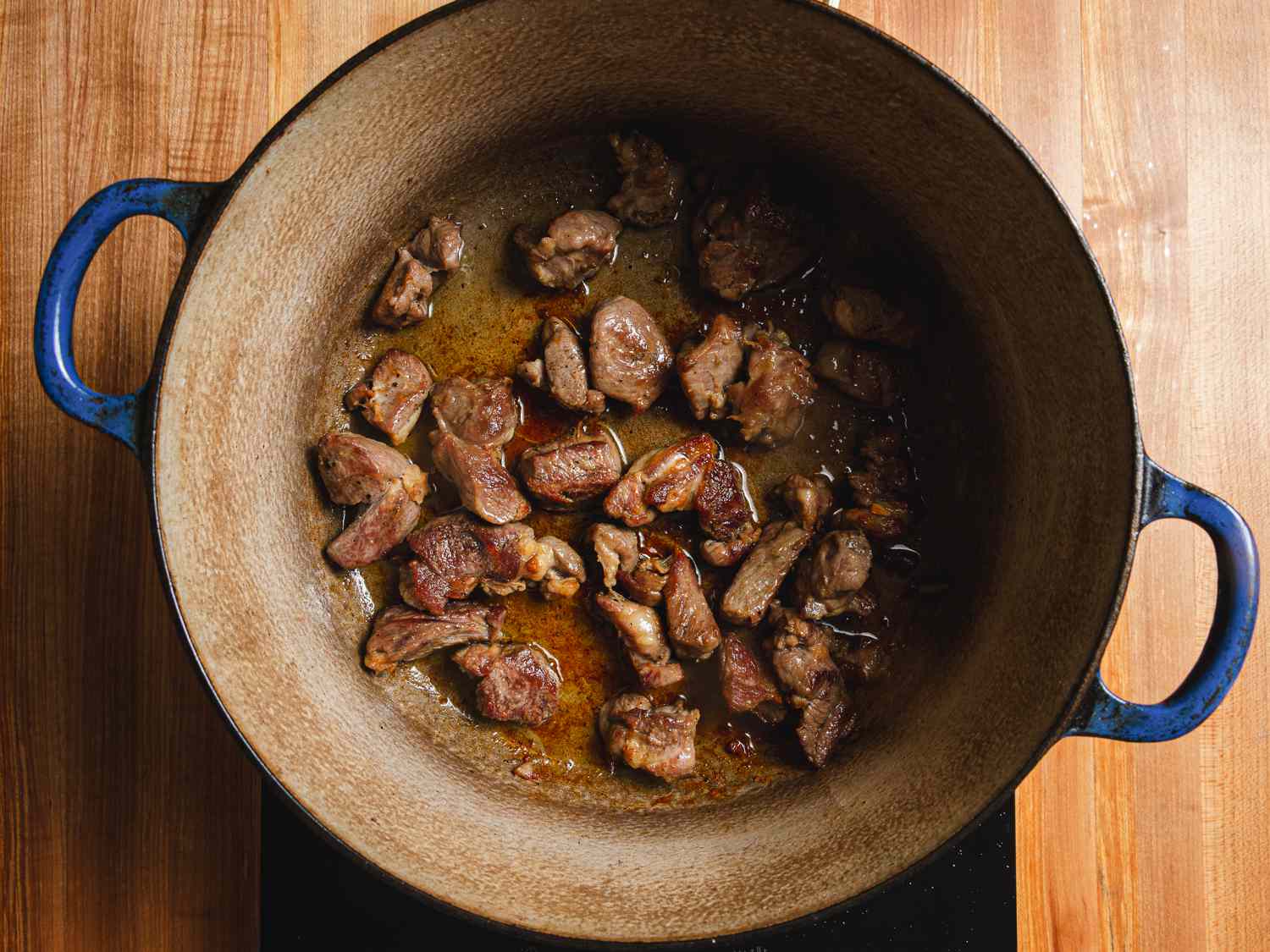 Overhead view of lamb cooked in a dutch overn