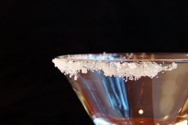 Sugar on the rim of a cocktail glass. 