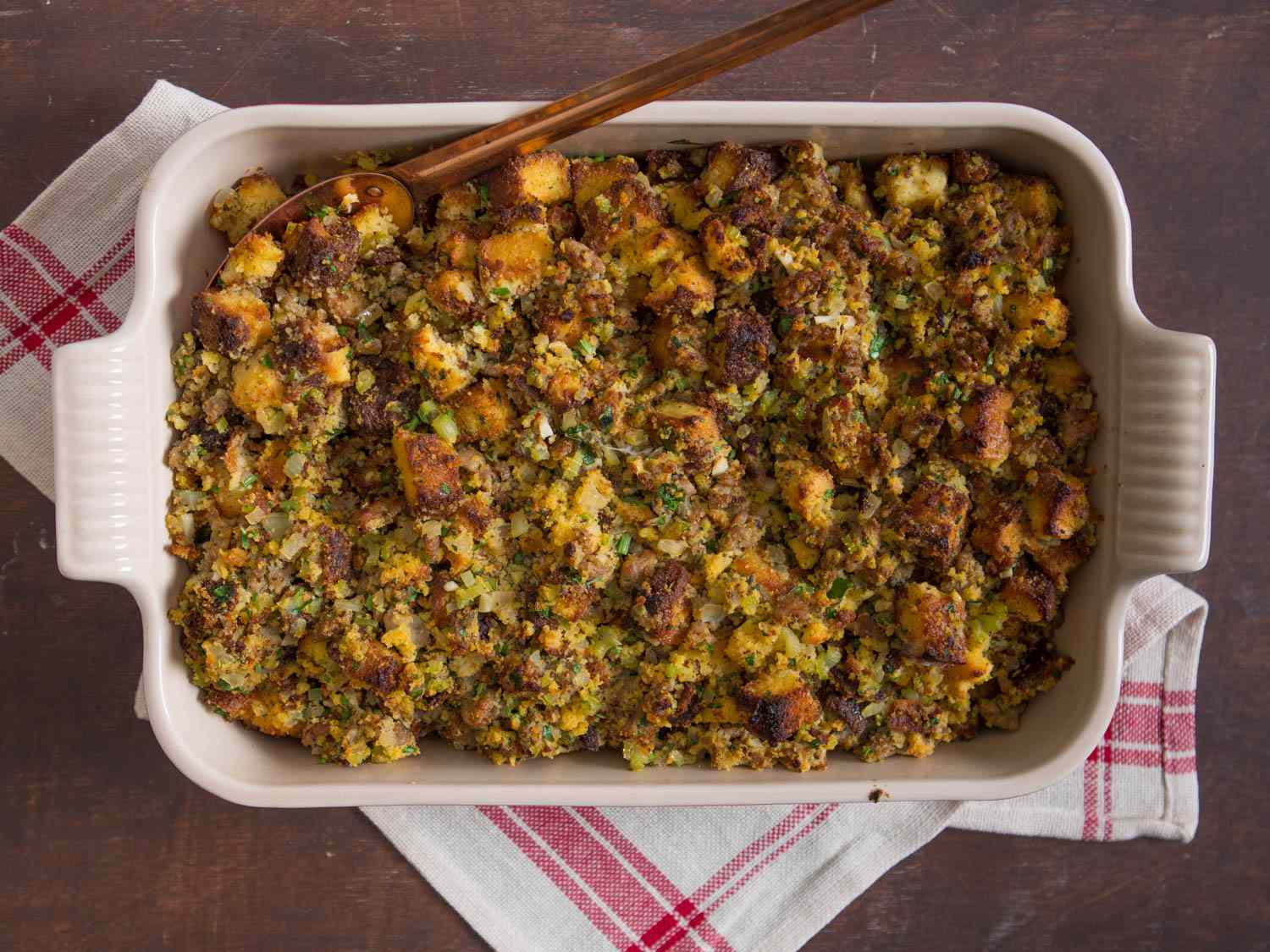 Top down view of cornbread dressing in a baking dish. 
