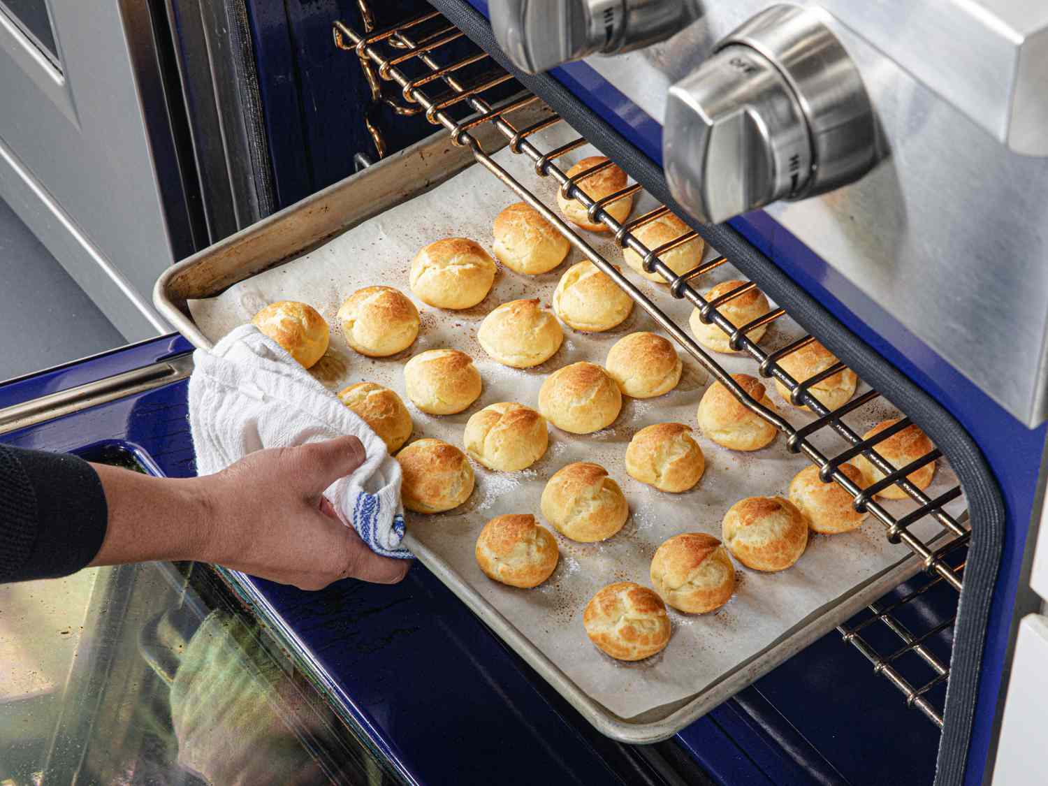 Turning croquembouche puffs in the oven