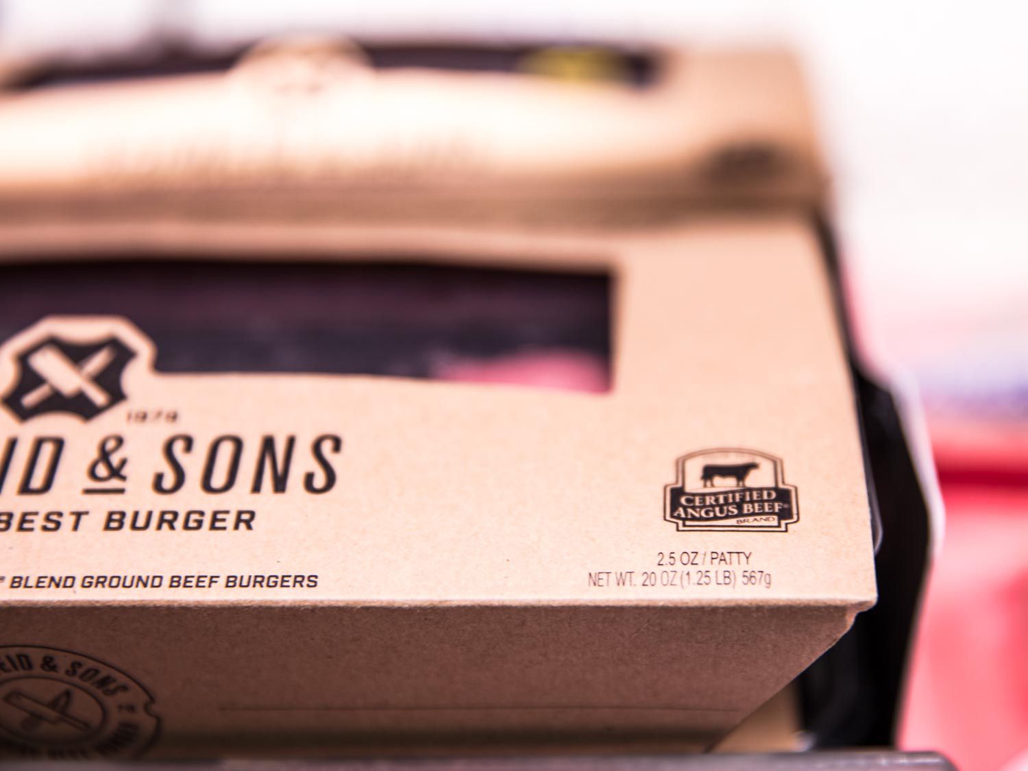 Closeup of a package of meat with a "Certified Angus Beef" badge printed on it.