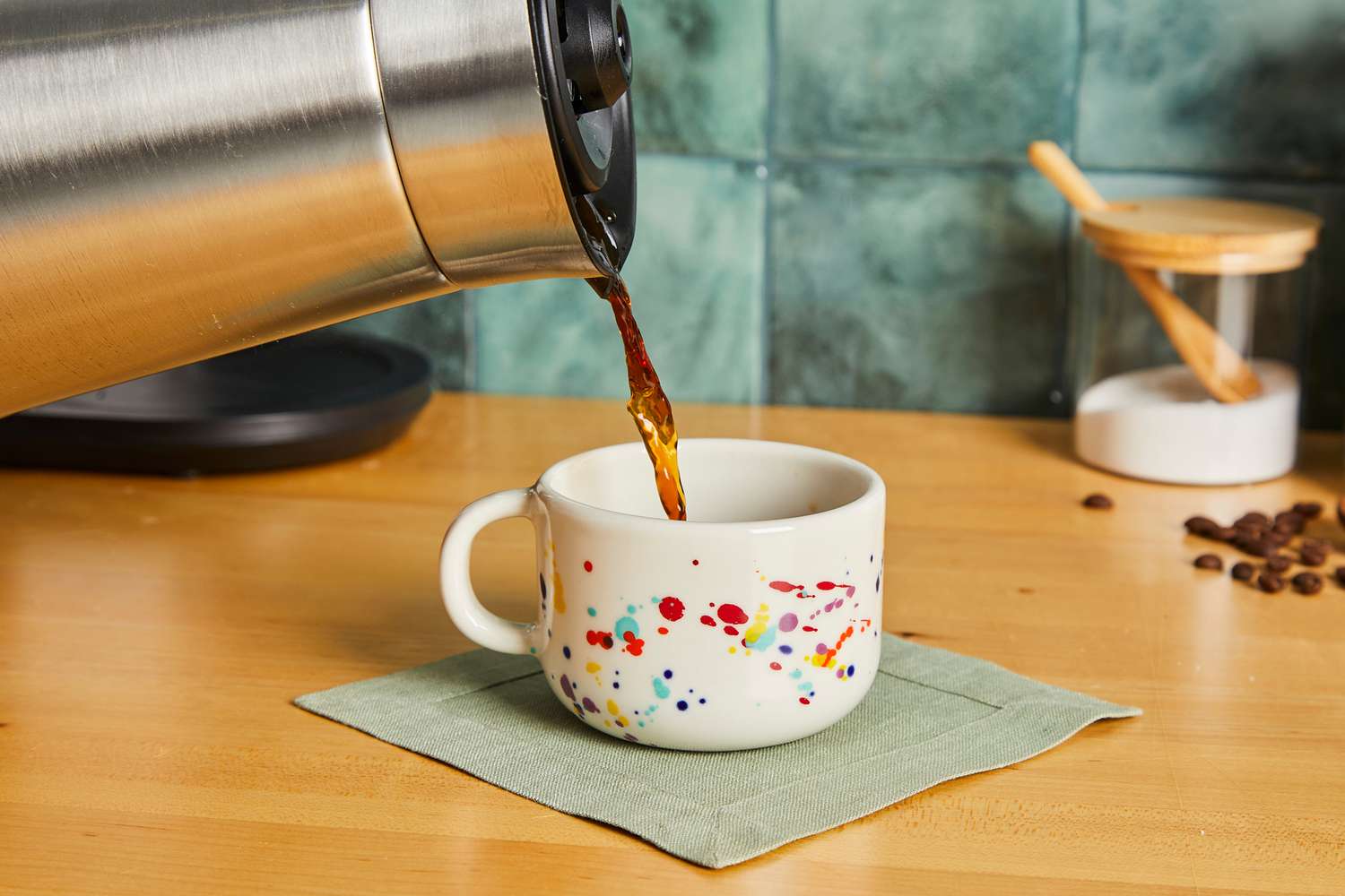 Coffee being poured into a Felt + Fat mug.