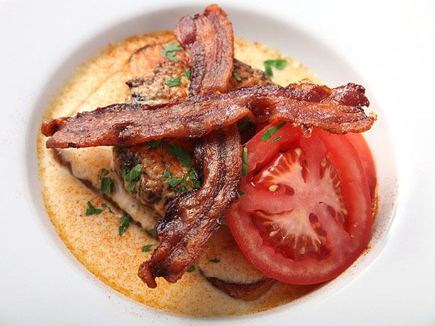 Overhead view of a hot brown burger, served in a shallow white bowl.