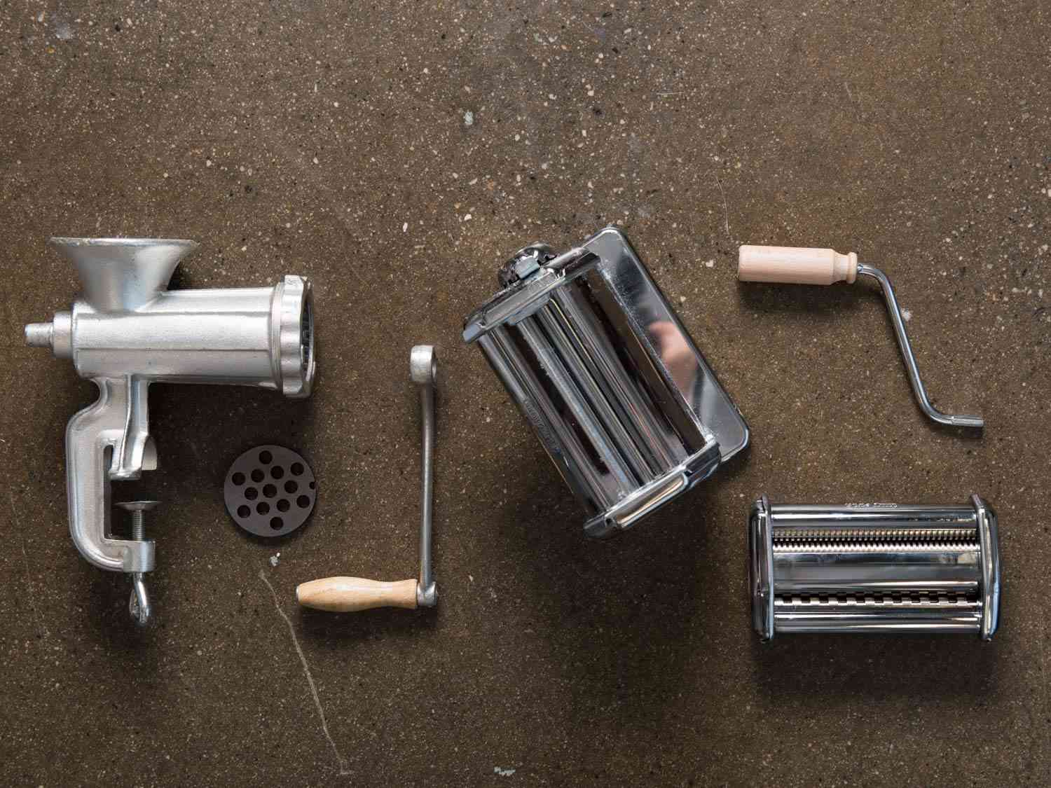 Mechanical cooking tools like a meat grinder and pasta rollers.