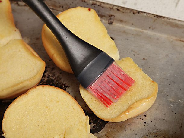 Potato rolls are brushed with bacon fat before toasting.
