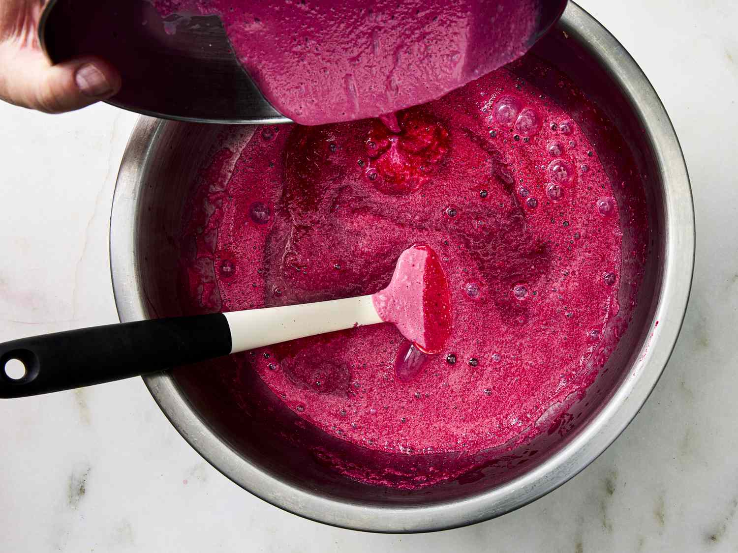 Combining sour cream with cold beet and cherry soup