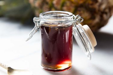 A jar of fresh pineapple syrup.