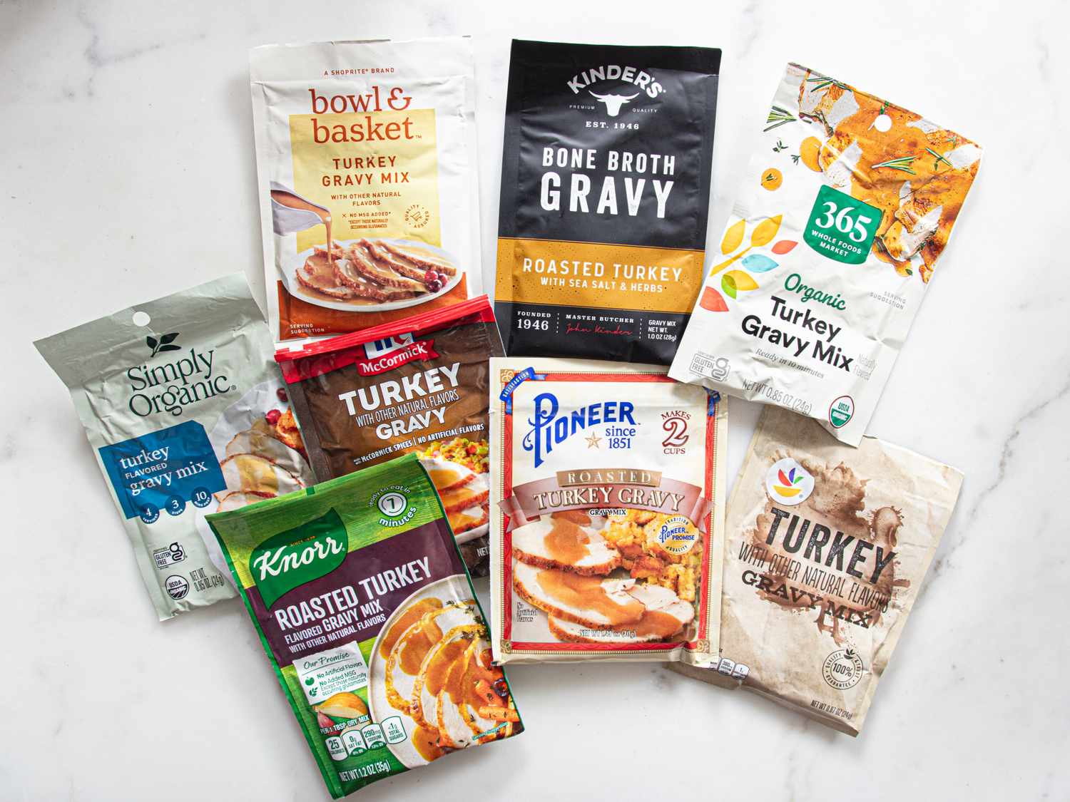 A variety of turkey gravy mix packages arranged on a surface