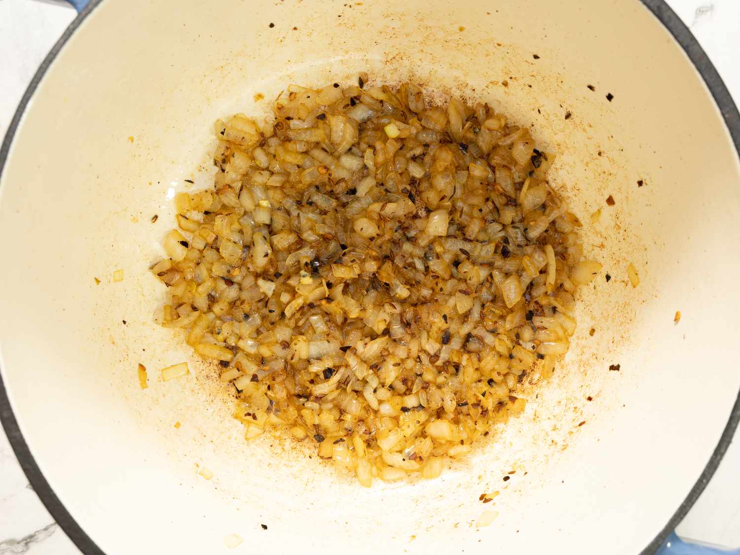 Sautéed onions in a pot for a cooking process