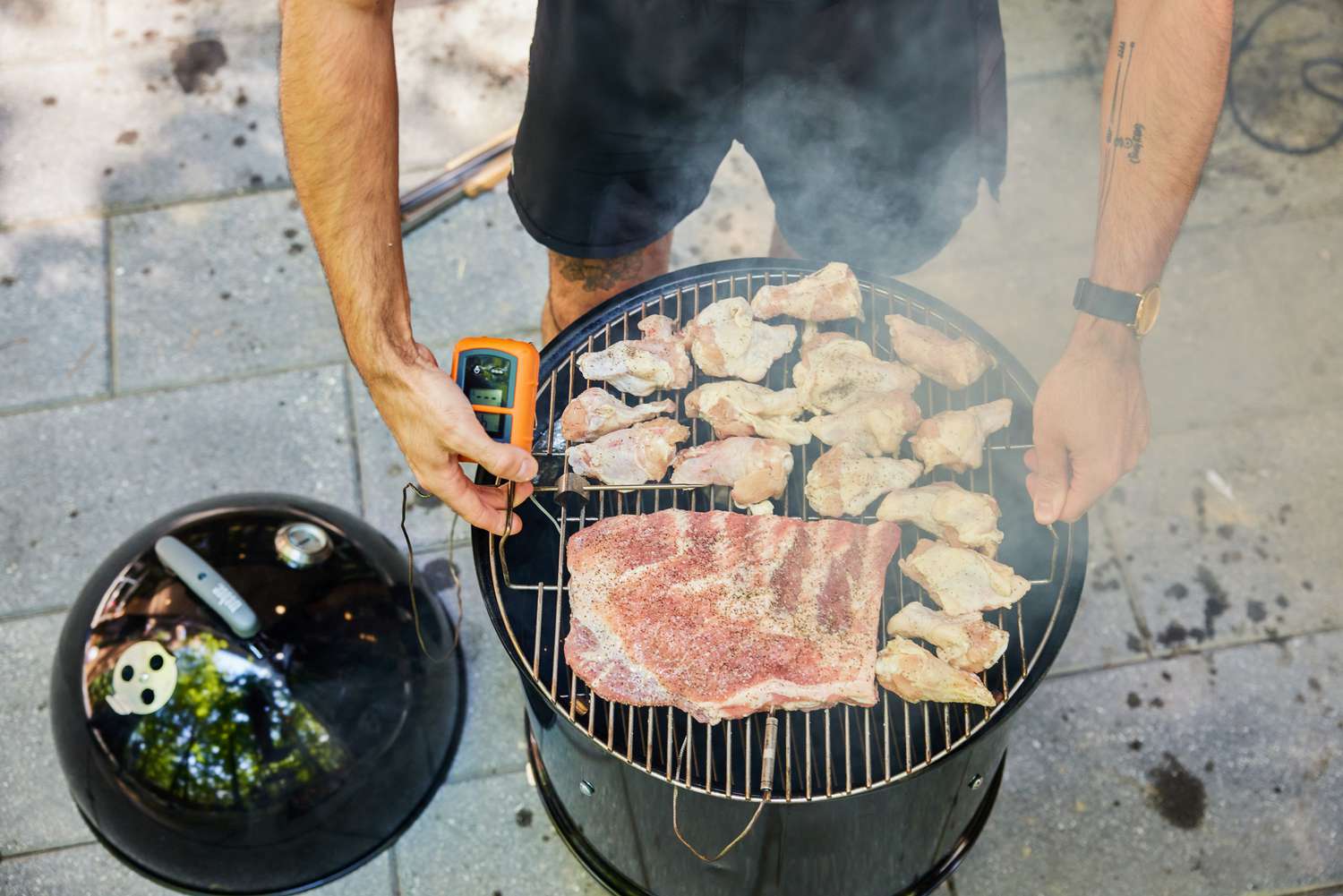 Meat is cooked in the Weber Smokey Mountain Cooker 18-Inch Charcoal Smoker (721001)