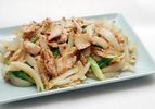 Platter of stir-fried chicken with scallions and ginger