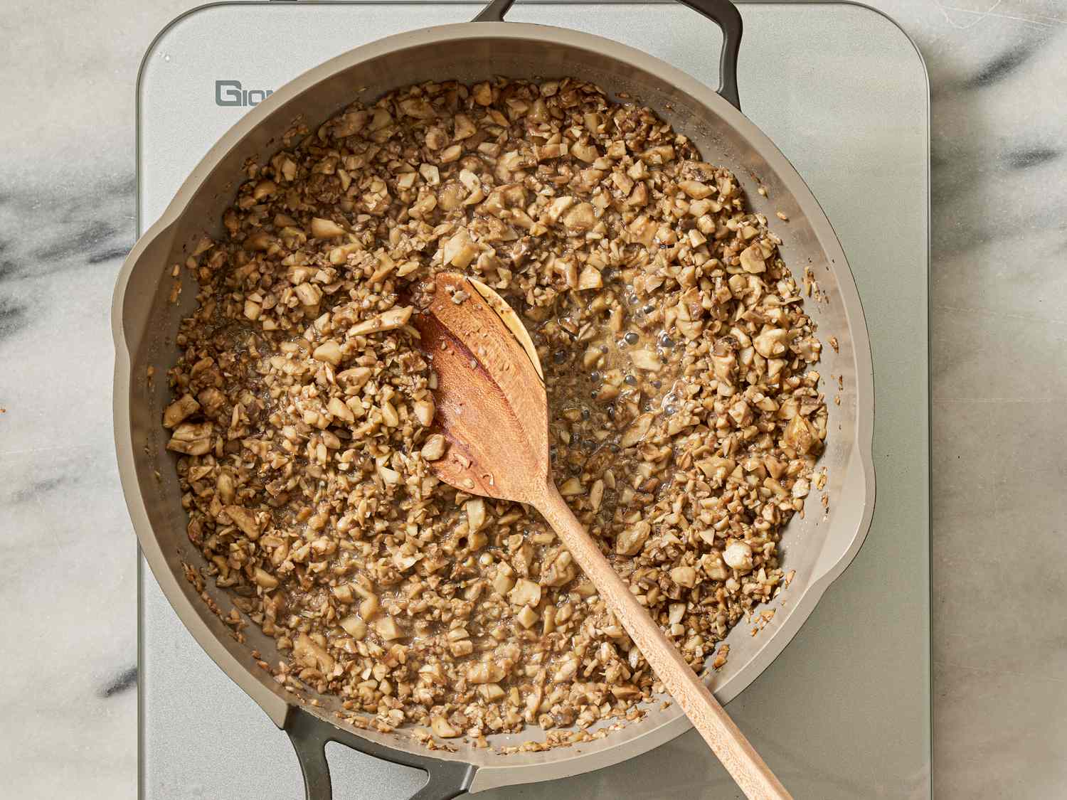 Overhead view of mushrooms cooking