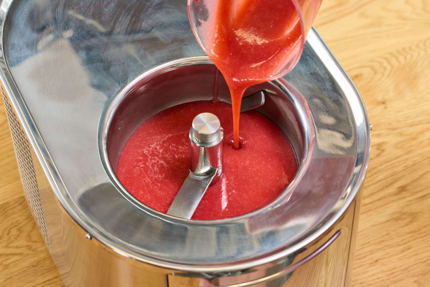 Red liquid flowing into the Lello Musso Lussino 4080 Ice Cream Maker