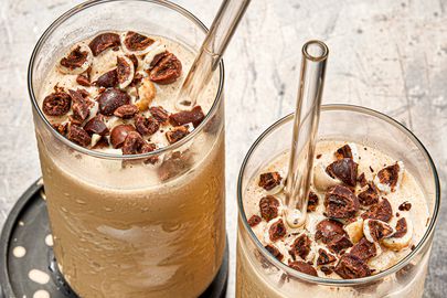 Overhead view of two coffee smoothies with glass straws