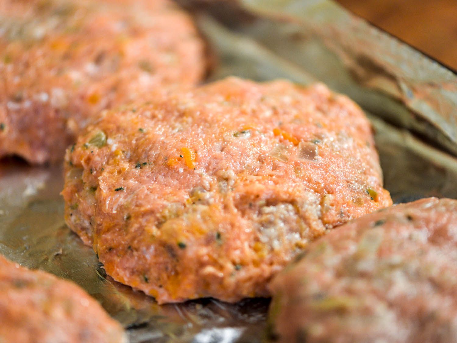 Formed turkey burger patties on a sheet pan.