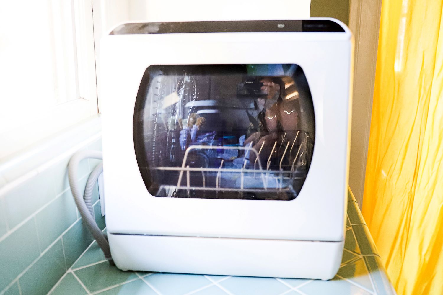 The Hermitlux countertop dishwasher on a kitchen countertop.