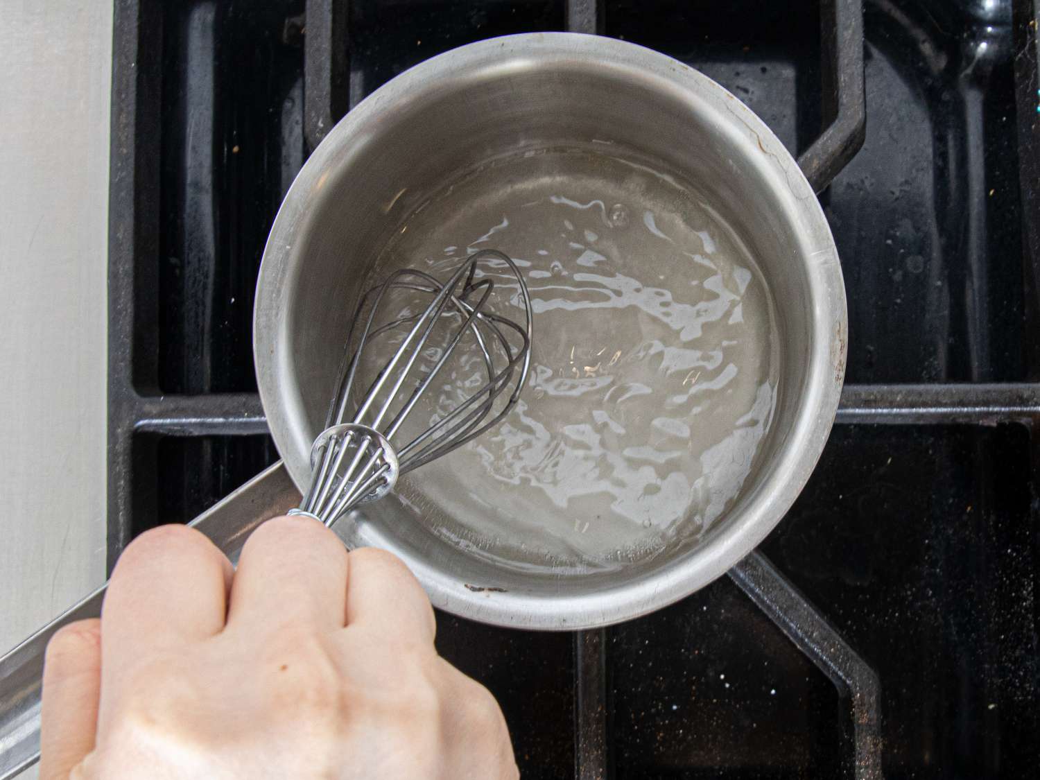 Overhead view of whisking simple syrup