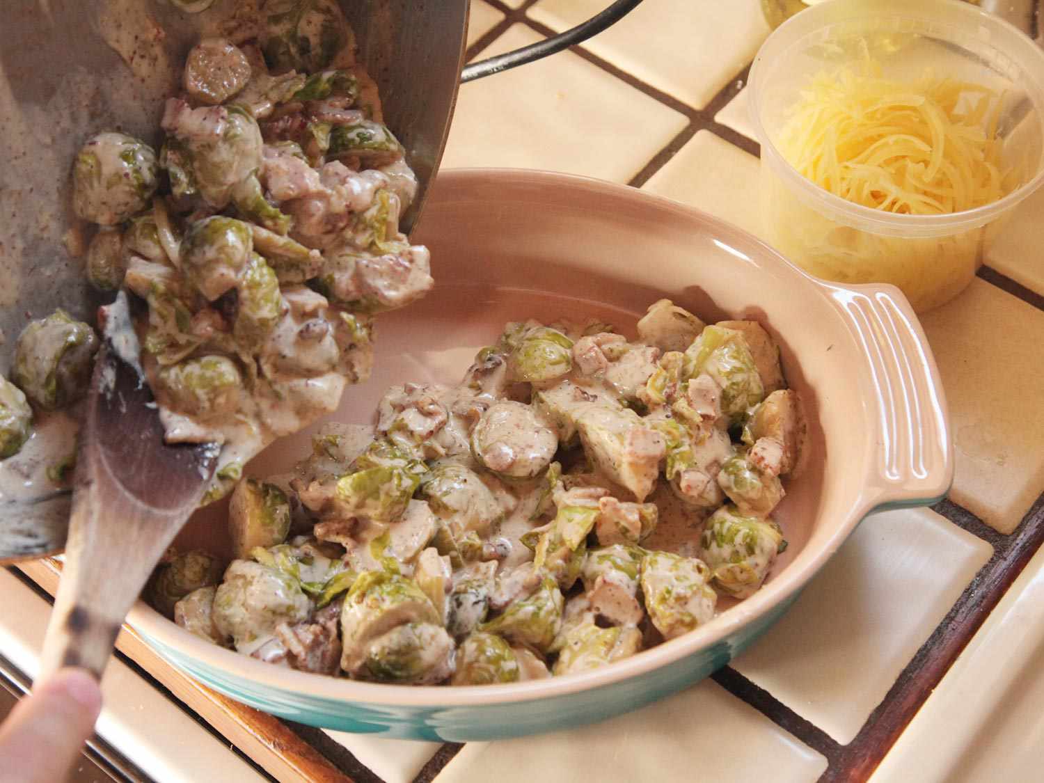 Pouring Brussels sprouts mixture into two quart casserole dish