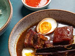 Close up of half an egg in the stew